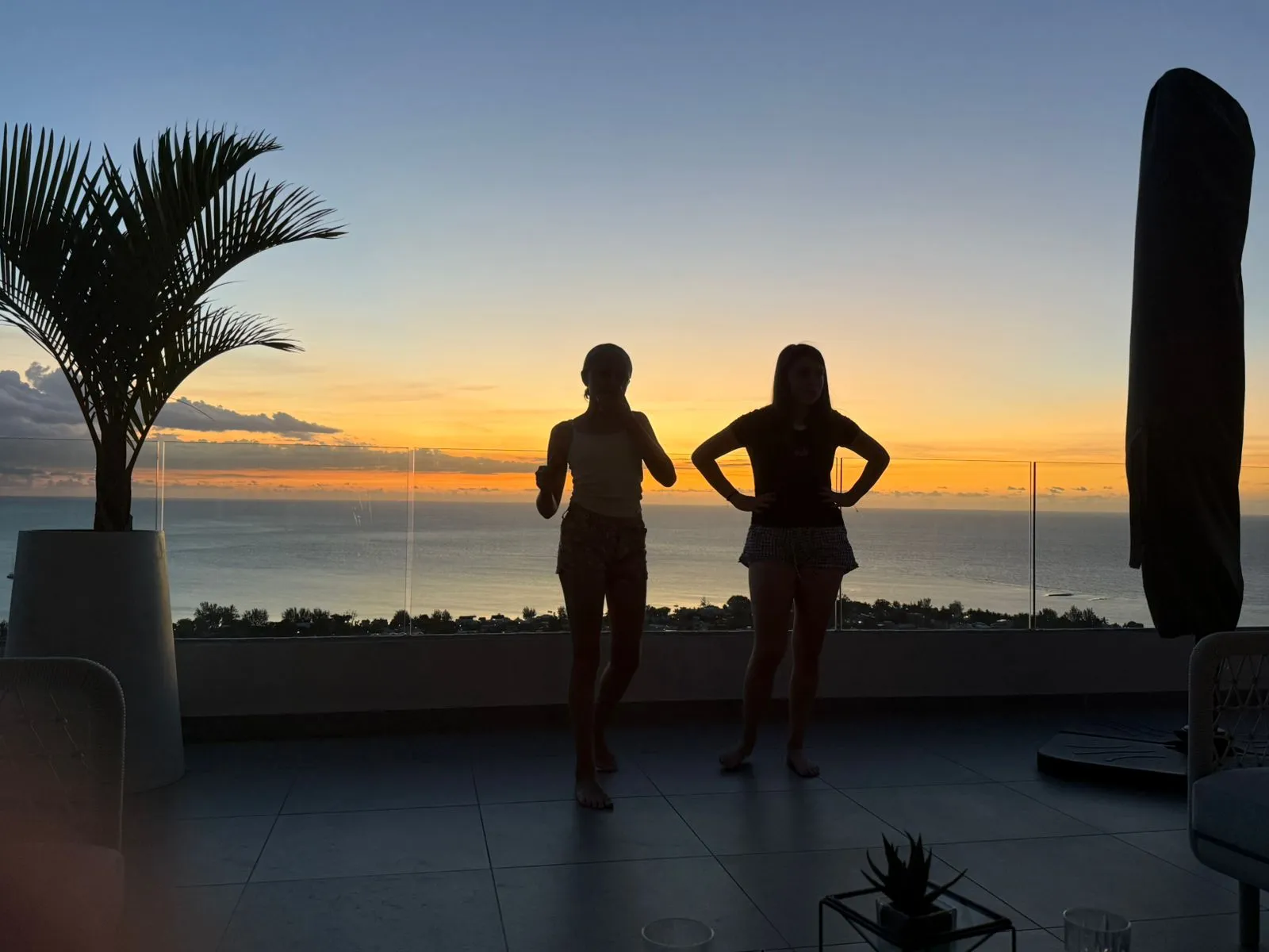 Friends watching sunset in Mauritius